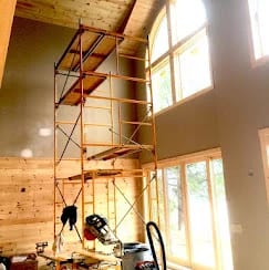 Scaffolding under a high ceiling in a new construction interior