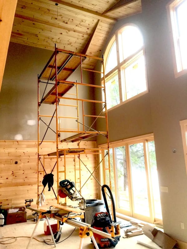 Scaffolding set up inside a home remodel for ceiling drywall work